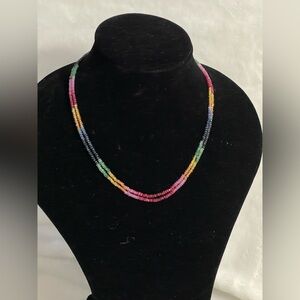 Natural faceted rondelle beaded necklace featuring sapphires rubies emeralds